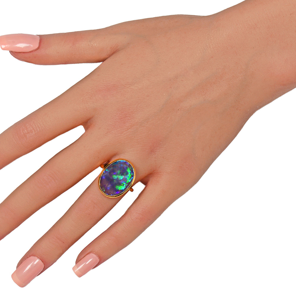 
                      
                        Antique Chromatic Black Opal Gold Ring
                      
                    