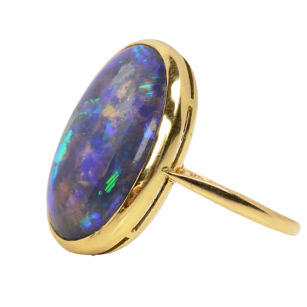 
                      
                        Antique Chromatic Black Opal Gold Ring
                      
                    