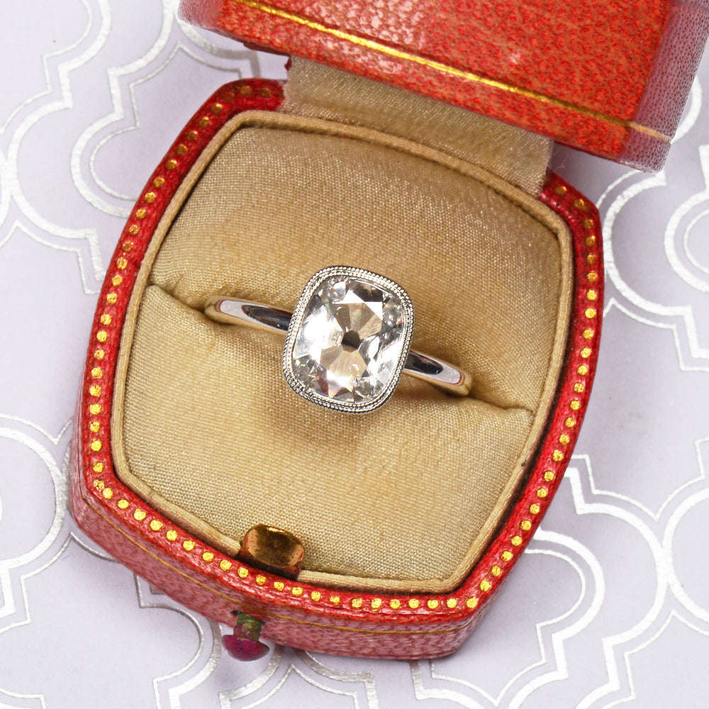 
                      
                        Antique Cushion Cut Diamond Platinum Ring
                      
                    