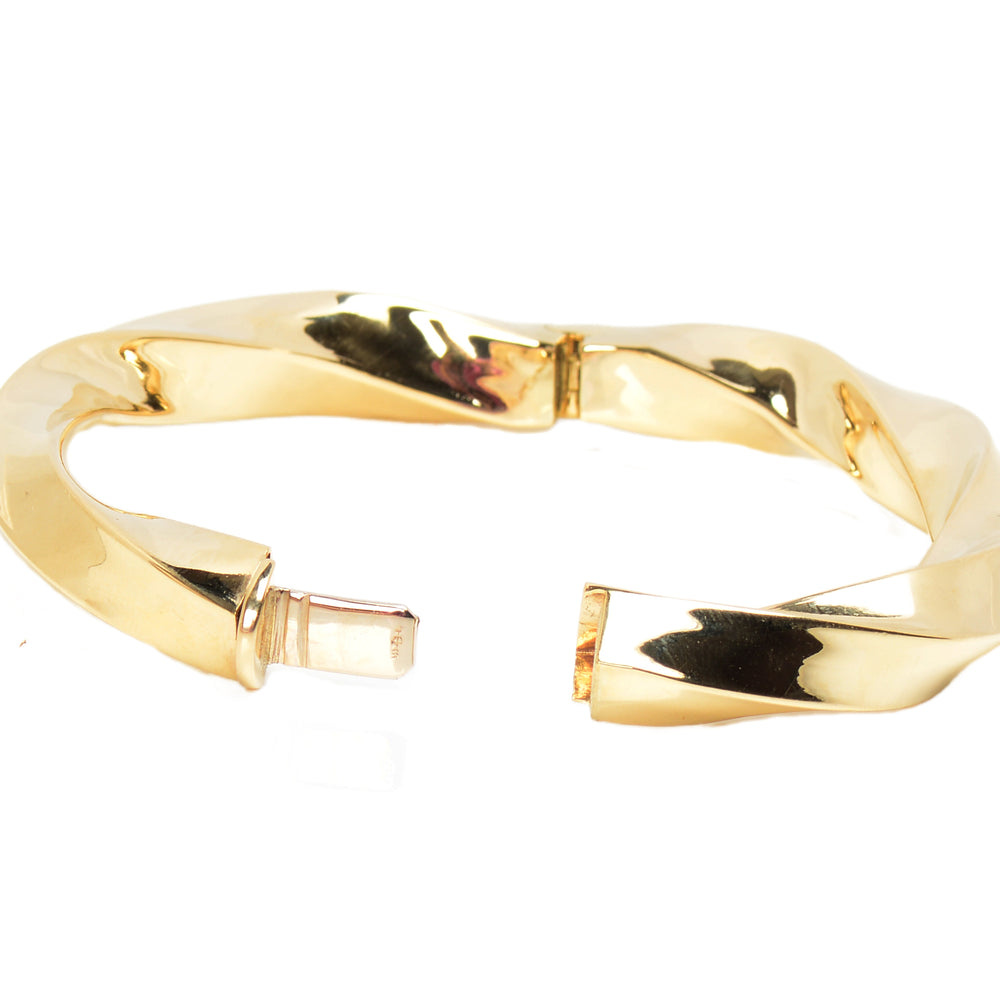 
                      
                        Italian Vintage 14k Gold Bangle Bracelet with a Twist
                      
                    