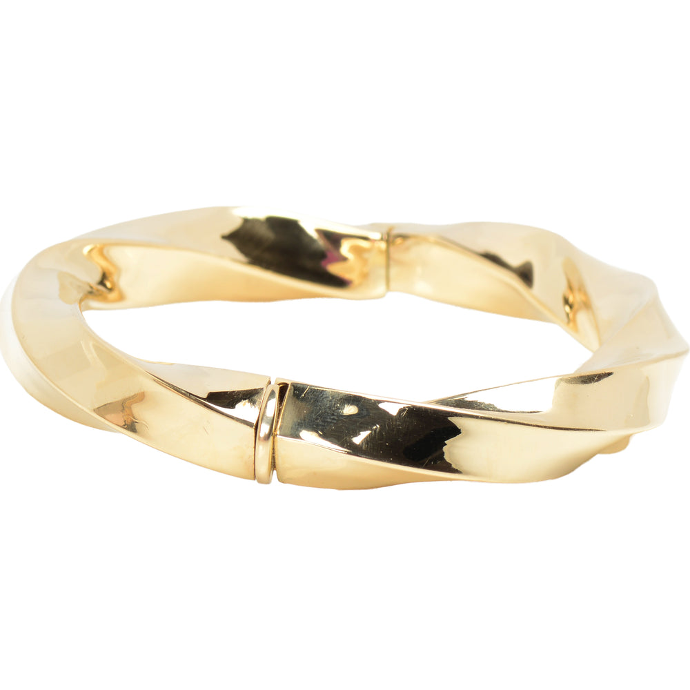 
                      
                        Italian Vintage 14k Gold Bangle Bracelet with a Twist
                      
                    