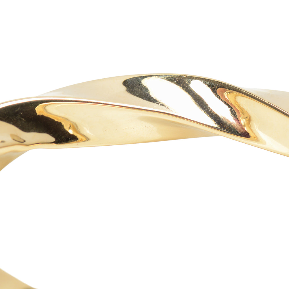 
                      
                        Italian Vintage 14k Gold Bangle Bracelet with a Twist
                      
                    