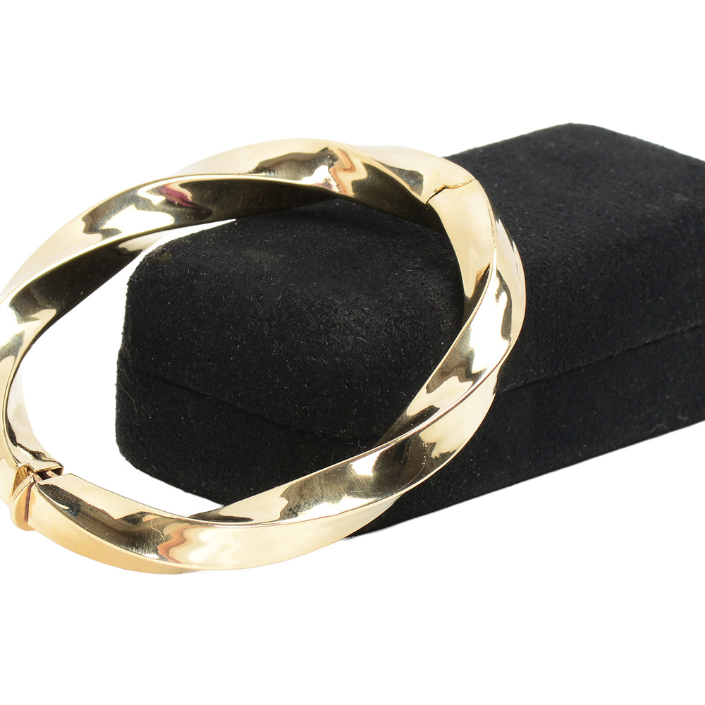 
                      
                        Italian Vintage 14k Gold Bangle Bracelet with a Twist
                      
                    