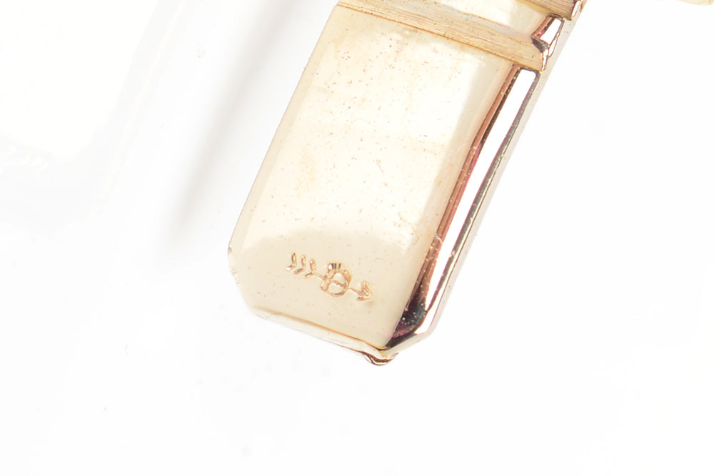 
                      
                        Italian Vintage 14k Gold Bangle Bracelet with a Twist
                      
                    